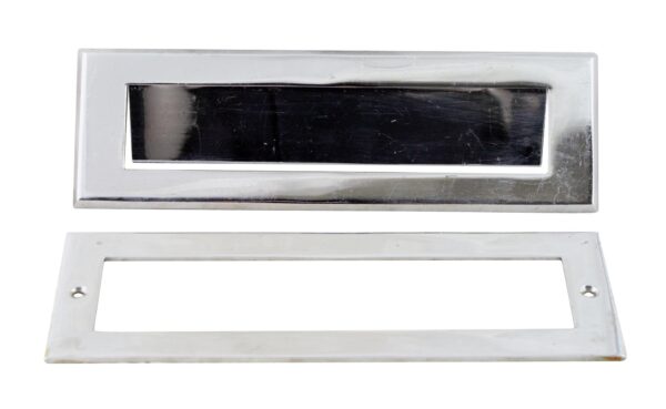 Stainless steel finished mail slot with a rectangular front plate and matching interior plate shown below.