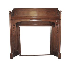 Traditional built-in mantel in a dark wood tone, shown front view with geometric side details and an open center opening.