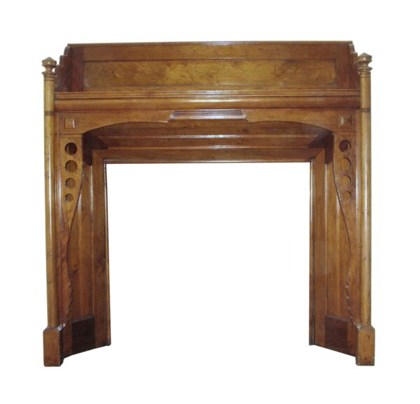Traditional reclaimed maple mantel with a dark wood tone, shown front on with geometric side details and an arched opening.