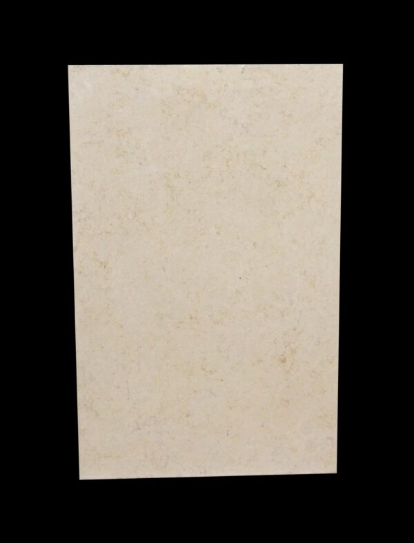 Tan marble slab with a lightly mottled surface shown front on.