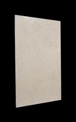 Tan marble slab shown upright at an angle, with a smooth rectangular face and slight veining visible across the surface.