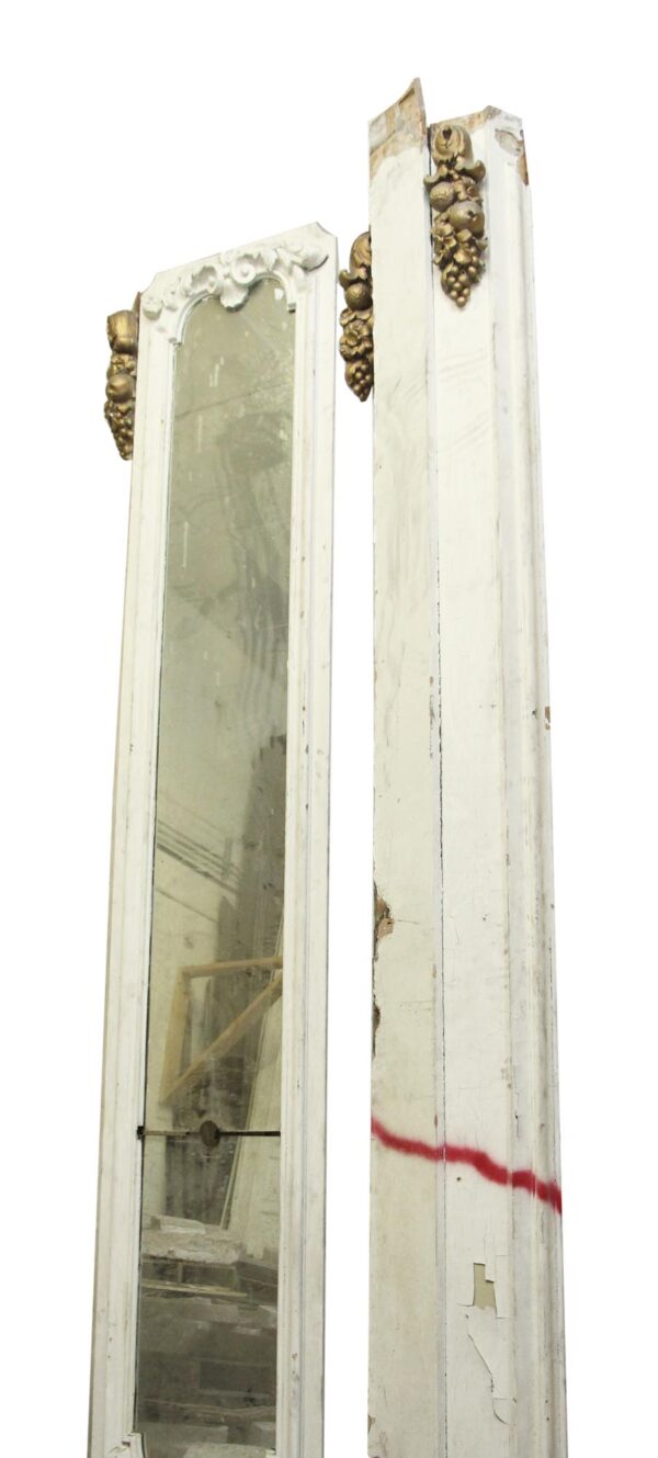 Tall narrow Victorian mirror with white wood framing, gold grape details, and a long mirrored panel shown beside a matching side panel.