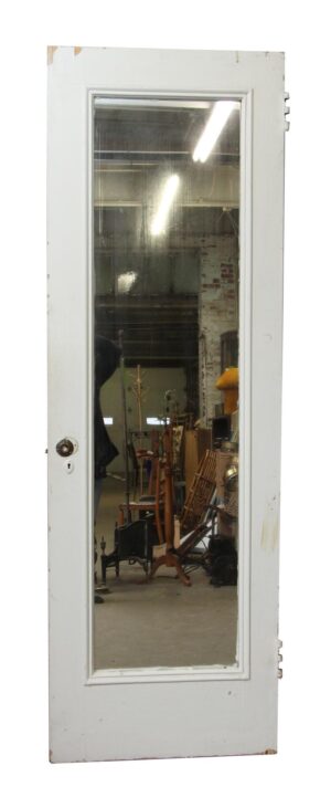 White mirrored closet door with one full-length pane and visible hinges, shown front-on.