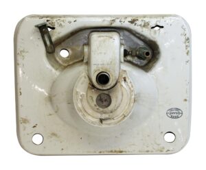 Top view of a white porcelain sink with a central drain opening, side faucet holes, and visible wear including stains and a hairline crack at the back center.