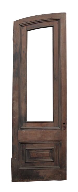Single slanted arch door in dark wood tone with a tall glass opening and two lower panels.
