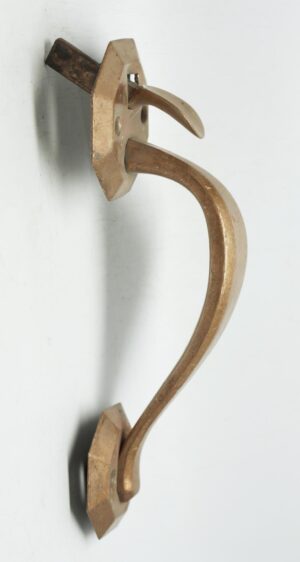 Antique bronze door pull with curved handle, thumb latch, and octagon plates seen in side view.