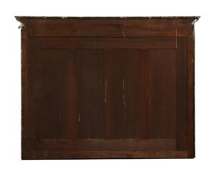 Back view of a traditional over mantel mirror with a dark wood tone mahogany frame, molded tiered cap, and visible hanging hardware.