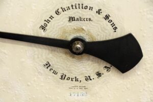 Close-up of the scale dial with a black pointer, showing John Chatillon & Sons, New York, and the stamped number 17152.