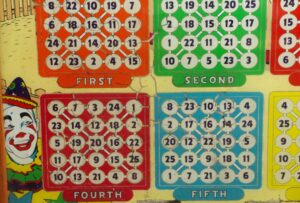 Colorful vintage pinball playfield with numbered lanes and sections labeled First, Second, Fourth, and Fifth.
