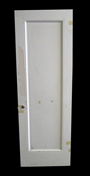 Single white wood passage door with one vertical panel and right swing orientation.