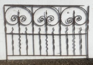 Wrought iron fence section with three fleur-de-lis scroll panels and vertical bars, shown frontally as a 30-inch decorative piece or gate section.