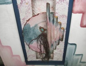Signed mixed media canvas painting with pink, blue, and white geometric forms, shown in a close-up view with cylindrical shapes and a visible mounting wire on the back.