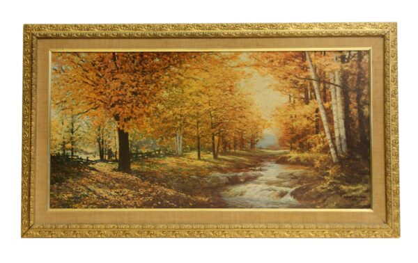 Ornately framed scenic autumn print with a gold-toned frame and a forest stream landscape.