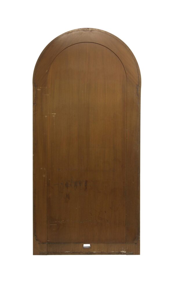Arched mahogany wood panel with a dark wood tone and a small cutout near the bottom.