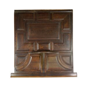 Dark tone oak wall panel with carved rectangular sections and a lower pair of arched panels.