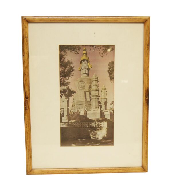 Framed and matted picture with a light wood tone pine frame, creme mat, and a photo of a large church.