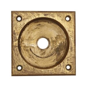 Square brass pocket door pull with four mounting holes and a central recessed finger grip, shown front view with visible surface scratches from age and use.