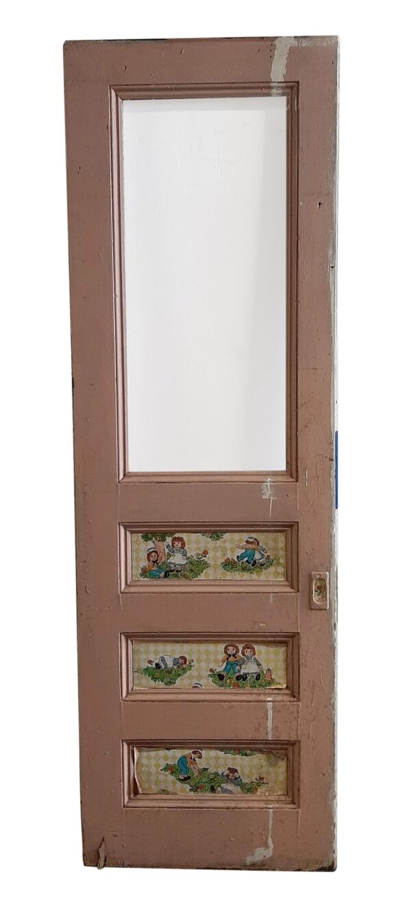 Tan wooden pocket door with one tall upper lite opening and three lower decorative panels, shown with the panel side facing out and a white painted reverse visible through the opening.