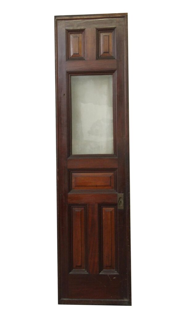 Vintage six-panel pocket door in dark wood tone with a large etched glass center panel and a visible roller at the bottom.
