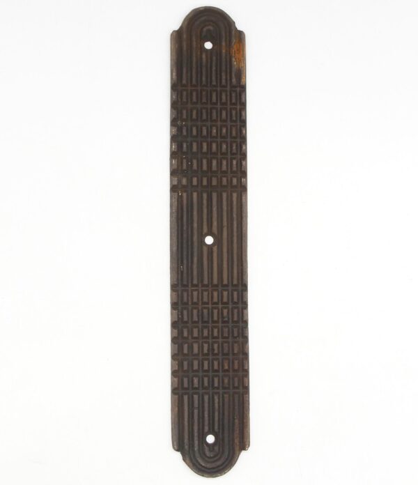 Art Deco cast bronze door push plate with a lined relief design and three mounting holes.