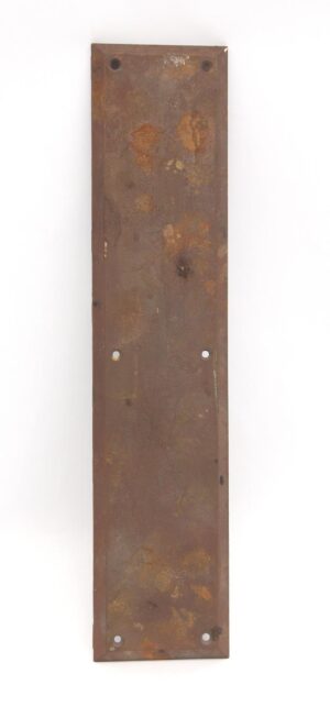 Vertical cast iron door push plate with beveled edges and four mounting holes, shown in a straight-on view with a worn surface.