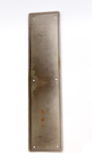Vintage steel door push plate shown vertically with four mounting holes and faint Russwin Enfield embossing near the top.