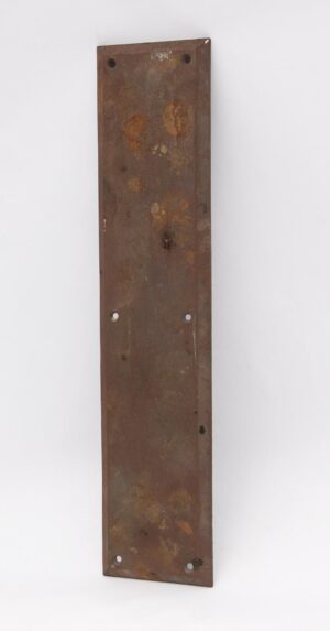 Cast iron beveled edge door push plate with four mounting holes and a weathered surface shown vertically.
