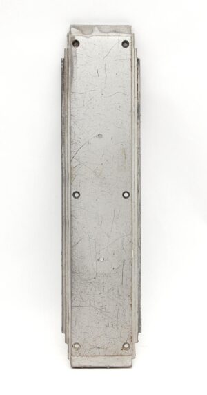 Vertical brushed aluminum door push plate with a rectangular Art Deco design and visible mounting holes, shown front on with surface scratches and wear.