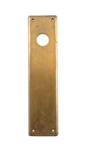 Vintage brass door push plate with a large circular lock insert opening and four screw holes, shown in a tall rectangular shape.