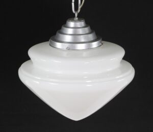 Mid century pendant light with a two-tier milk glass globe and a four-tier silver fitter.