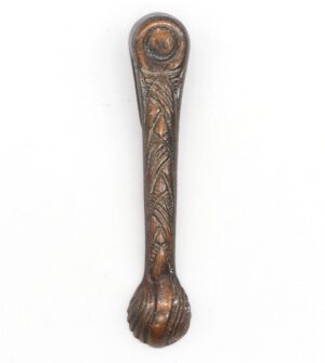 Decorative antique window latch with a copper finish and carved detail, shown vertically with a rounded top and original catch not included.