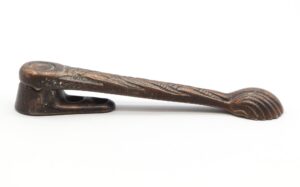 Antique window latch with a decorative handle and worn copper finish, shown in side view with the catch not included.