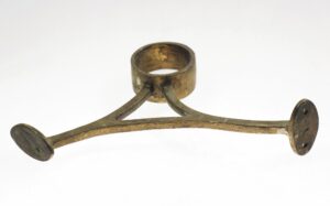 Curved brass bracket with a circular collar and two mounting plates, shown in a side view.