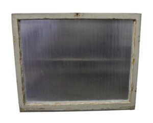 Vintage window with a painted white wood frame and rippled clear glass panel.