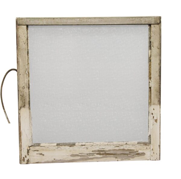 White wooden window with frosted snowflake glass and a weathered painted frame, shown front on.