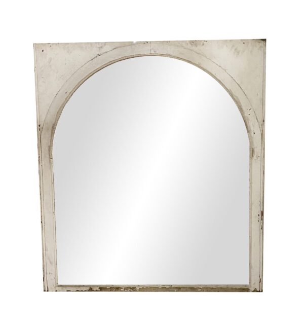 Arched sash window with a wooden frame and a large glass pane.