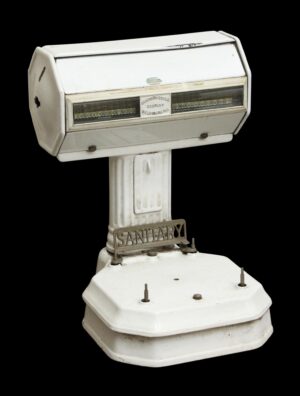 White enamel sanitary scale with a cast iron base, front display windows, and a missing pan.