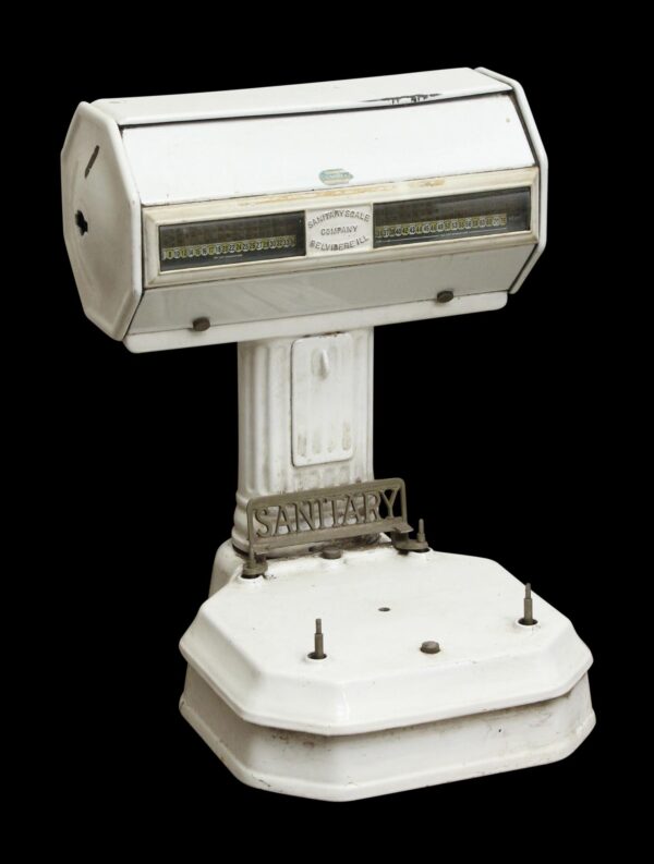 White enamel sanitary scale with a cast iron base, front display windows, and a missing pan.