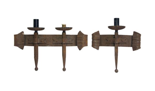 Pair of wrought iron wall sconces, one with two lights and one with a single light, shown front view.
