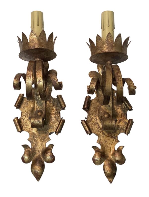 Pair of Gothic wall sconces with gilt wrought iron detailing and ornate leaf-like accents, shown front view on a white background.