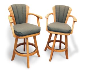 Pair of Art Deco style bar chairs with high backs, armrests, and footrests, shown in a front view with green upholstered seats and backs and light wood frames.