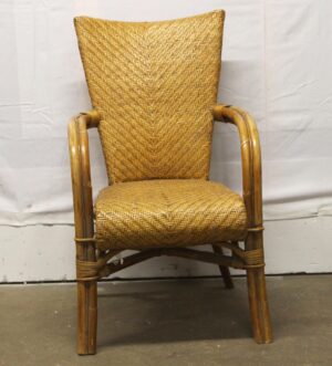 Vintage tan wicker chair with a wooden frame, shown from the front with woven back, seat, and armrests visible.