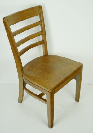 Wood chair with a slatted back and medium wood tone, shown at a three-quarter angle.