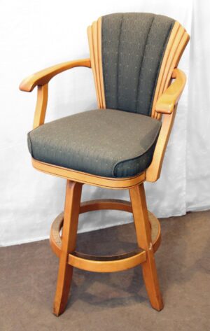 High-back bar chair with armrests, a footrest, and green fabric upholstery on a light wood frame.