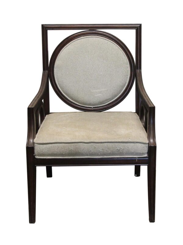 Wooden armchair with a dark wood tone frame, gray upholstered seat and round back, shown from the front with visible wear on the fabric.