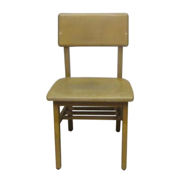 Light wood tone school chair with a rectangular backrest and under-seat shelf.