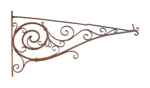 Victorian wrought iron sign bracket with ornate scrolled arms, visible rivets, and a rust patina on a white background.