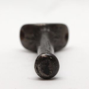 Single vintage cast iron wardrobe hook with a rounded back and one mounting point visible in front view.