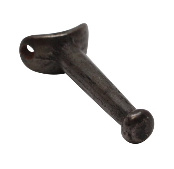 Single cast iron wardrobe hook with a rounded back and one mounting hole, shown at an angle.
