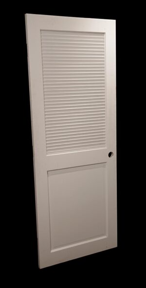 White wooden closet door with one louvered top panel and one solid lower panel, shown angled with the round handle opening visible on the right side.